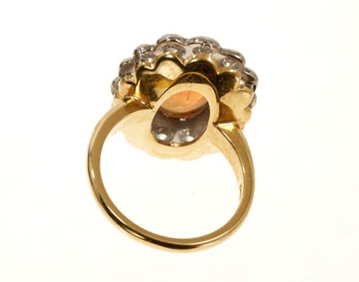 Lot 635 - Opal and diamond cluster ring with an oval opal cabochon weighing 1.96ct surrounded by a border of brilliant cut diamonds weighing 1.45ct in total. In 18ct gold