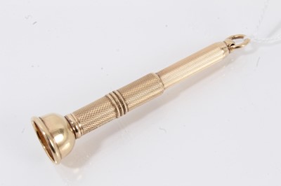 Lot 710 - 9ct gold cigar pricker with engine turned decoration