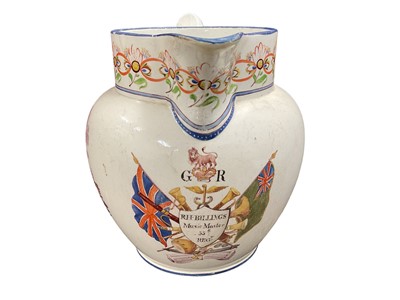 Lot 757 - Military interest- Georgian pearlware pottery jug with hand painted panel depicting military trophies and named 'R. H. Billings, music master, 55 regt.", 16cm in height.