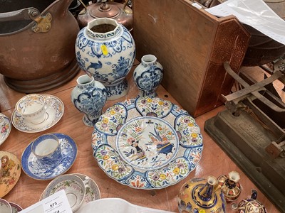 Lot 565 - Trio of Delft pottery vases and a tin glazed charger (4)