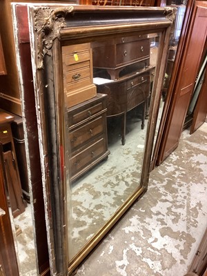 Lot 1476 - Large bevelled wall mirror in gilt and black frame