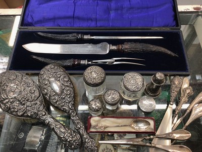 Lot 1141 - Silver backed brushes, silver topped glass jars, silver handled flatware, cased carving set and other items