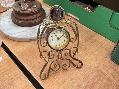 Lot 607 - Early 20th century brass desk clock, set with a cameo.