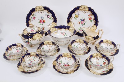 Lot 286 - Victorian floral painted part tea set on cobalt and gilt ground