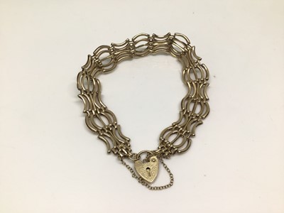 Lot 1149 - 9ct gold gate bracelet with padlock clasp