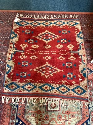 Lot 1505 - Eastern rug on red, blue and brown ground, 94.5cm x 87cm, together with three other rugs