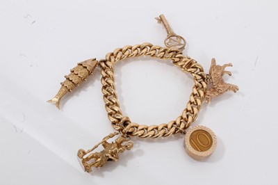 Lot 702 - Gold charm bracelet