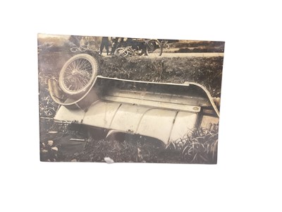 Lot 19 - Early motoring interest - 1920's photographs, newspaper cutting and related ephemera relating to a car crash, mounted in a glazed frame.