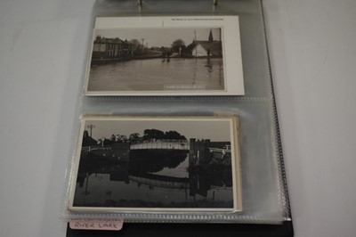 Lot 1503 - Postcards in album, include many real photographic cards of Cambridge villages, Baptising at Isleham Ferry (x6),  Isleham street scenes, parade 1912, Quoit Team 1912, Fairy Play 1920, burial ground...