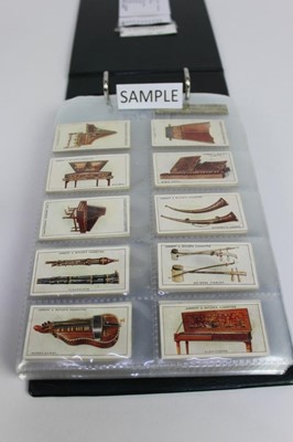 Lot 1423 - Cigarette cards collection in album of music related cards including Lambert & Butler interesting musical instruments, Edwards Ringer & Biggs musical instruments, Ruddell Ltd Grand Opera Series, So...