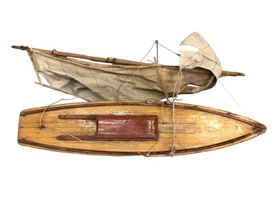 Lot 1828 - Wooden model yacht and stand.