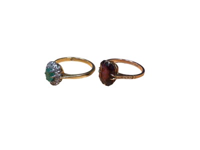 Lot 110 - Emerald and diamond cluster ring in 18ct gold setting together with a 1930s 9ct gold garnet ring (2)