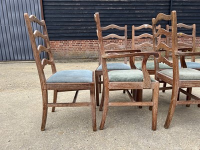 Lot 17 - Set of seven early 20th century lined oak ladder back chairs, with two carvers