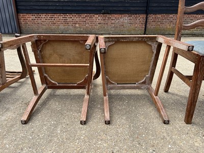 Lot 17 - Set of seven early 20th century lined oak ladder back chairs, with two carvers