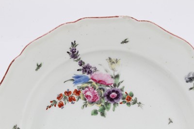 Lot 231 - An 18th century Chelsea porcelain plate, polychrome painted with floral sprays, with iron-red painted scalloped rim, 22.5cm diameter