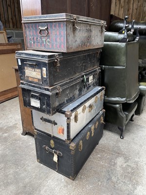 Lot 57 - Three early 20th century military tin trunks, together with two ther later trunks (5)