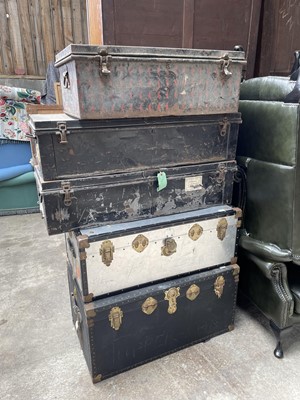 Lot 57 - Three early 20th century military tin trunks, together with two ther later trunks (5)