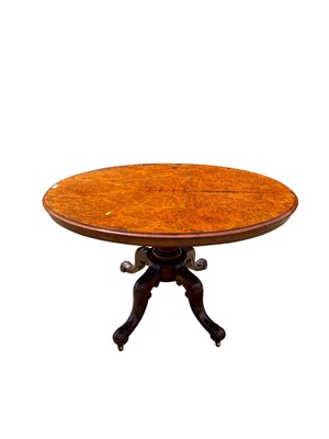 Lot 69 - Victorian burr walnut oval tilt top loo table on turned column and four splayed legs, 120cm x 88cm