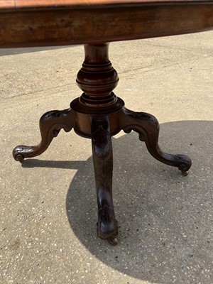 Lot 69 - Victorian burr walnut oval tilt top loo table on turned column and four splayed legs, 120cm x 88cm