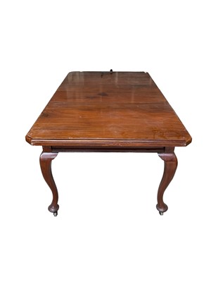 Lot 36 - Edwardian extending mahogany dining table, with canted rectangular wind out top on cabriole legs and castors, with one additional leaf, 103 x 127cm extending to 103 x 180cm