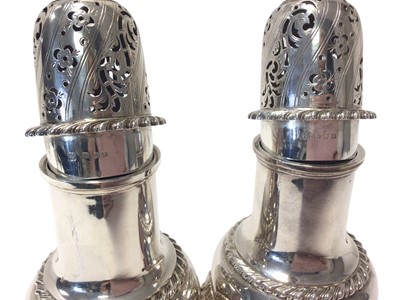 Lot 478 - Pair of 1930s silver sugar casters of baluster form on three lion mask and claw feet