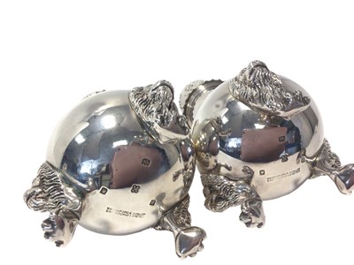 Lot 478 - Pair of 1930s silver sugar casters of baluster form on three lion mask and claw feet