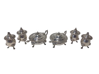 Lot 480 - 20th century silver composite cruet set with gadrooned borders and lion mask and paw feet