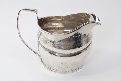 Lot 481 - George III silver cream jug of waisted form, with bright cut decoration