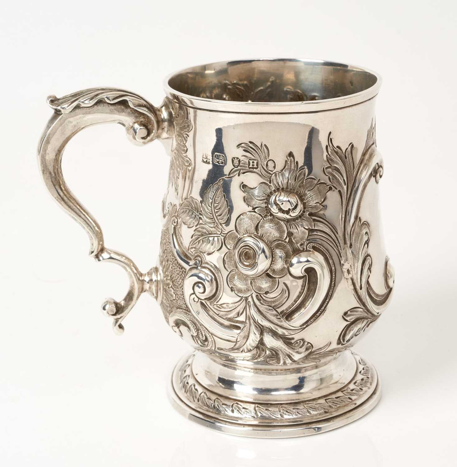 Lot 482 - George III half pint silver tankard with foliate chased decoration Peter.Anne & William Bateman