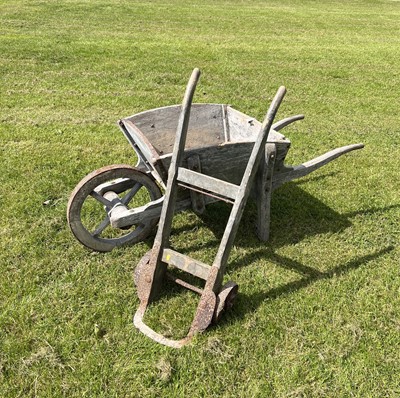 Lot 102 - Antique painted wooden wheelbarrow, together with a similar sack barrow. (2)