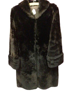 Lot 2174 - Beaver lamb coat and a black Astraka faux Persian lamb coat