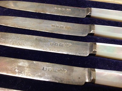 Lot 117 - Cased set of six Goldsmiths & Silversmiths silver and mother of pearl handled knives and a Victorian set of six similar fruit forks