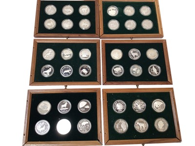 Lot 526 - World - Spink W.W.F. silver Commemorative coin collection housed in wood cabinet x 42, loose x 5 (Total 47 coins), British Virgin Islands proof set 1973 & others (Qty)