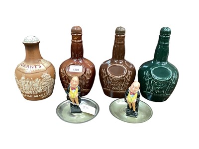 Lot 43 - Two Royal Doulton Kingsware whisky flagons, together with Spode and another Doulton whisky flagon, and a pair of Doulton figural ashtrays