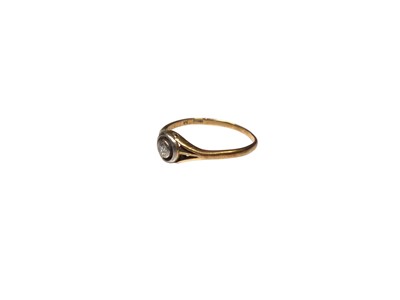 Lot 192 - 18ct gold diamond single stone ring with a brilliant cut diamond, estimated to weigh approximately 0.08cts, in a rub over setting with split shoulders
