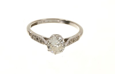 Lot 639 - Diamond single stone ring with further diamonds to the shoulders