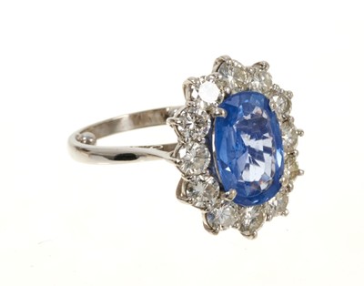 Lot 637 - 18ct white gold sapphire and diamond cluster ring