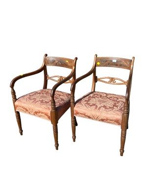 Lot 131 - Pair of Regency mahogany open elbow chairs with upholstered seats, on turned and sabre legs