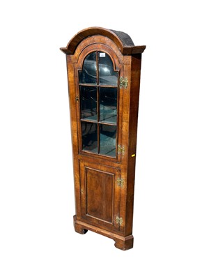 Lot 132 - Queen Anne-style walnut corner cupboard of small proportions, with arched top above a glazed door and panelled cupboard below, 164cm high