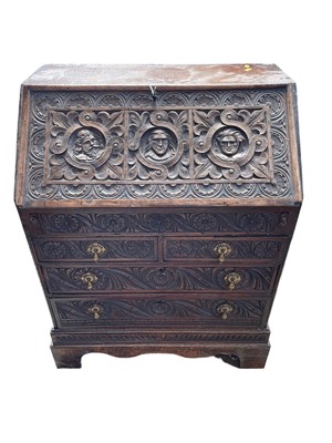 Lot 111 - Early 18th century and later carved oak bureau, 74w x 46d x 96h