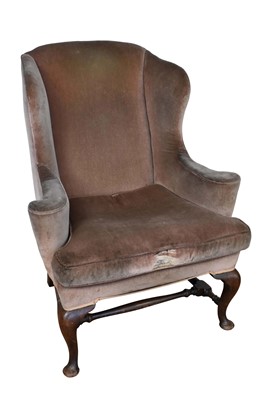 Lot 1351 - 18th century style walnut wing armchair, on cabriole legs and pad feet