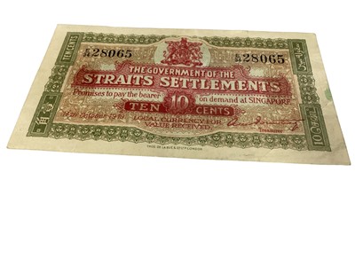 Lot 529 - Straits Settlements - Ten Cents banknote 14.10.19. Red & green on grey-brown underprint.  Rev: Green dragon at centre series E34 (N.B. Three minor fold marks & Obv: Small green stain on right edge...