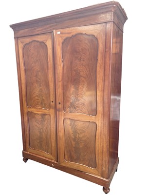 Lot 146 - Late 19th century mahogany two door wardrobe with hanging and shelved interior