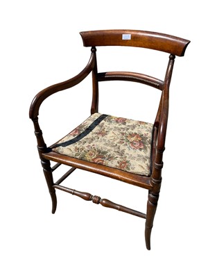 Lot 158 - Oak oval drop flap table with barley twist legs, with a Regency open armchair