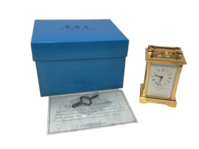 Lot 2409 - Garrard London brass cased carriage clock, with winding key, certificate and boxed as new