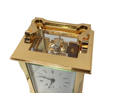 Lot 2409 - Garrard London brass cased carriage clock, with winding key, certificate and boxed as new