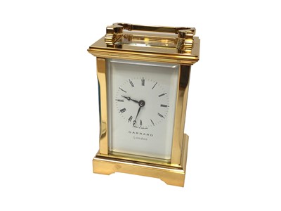 Lot 2409 - Garrard London brass cased carriage clock, with winding key, certificate and boxed as new