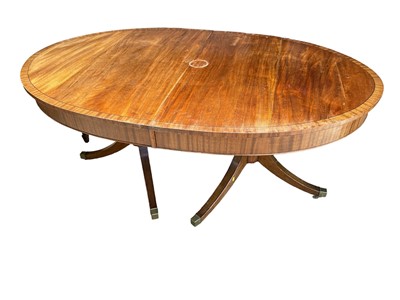 Lot 181 - Mahogany and ebony line inlaid oval extending dining table, with two leaves, 167 x 105cm extending to 240 x 105cm