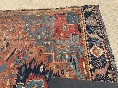 Lot 1587 - Good quality large antique Heriz rug, reduced in size