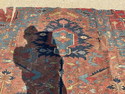 Lot 1587 - Good quality large antique Heriz rug, reduced in size